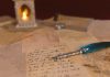 a pen sitting on top of a piece of paper