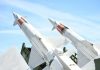 Stocuri critice de rachete Patriot ale SUA în Europa Two white missiles pointed upwards against blue sky