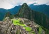 Cum au reconfigurat Bingham și Gene Savoy harta Vilcabamba The ancient stone ruins of Machu Picchu nestled among lush green mountains in Peru