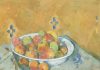Bowl of apples on a patterned tablecloth