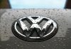 water dew on silver Volkswagen car emblem